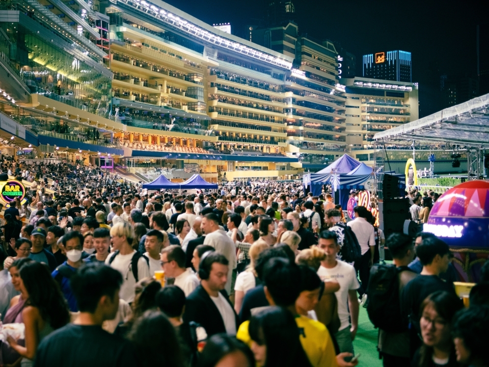 Party atmosphere at the Happy Valley Racecourse on Happy Wednesday nights.