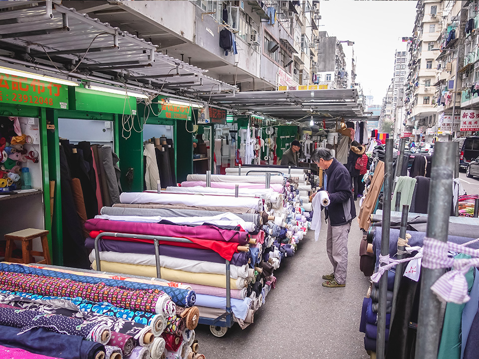 Rolls of fabric for sale at street stalls on Ki Lung Street, Sham Shui Po