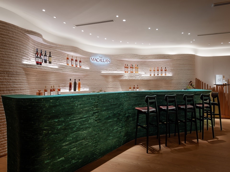 Waved stone walls and bar at The Macallan House in Hong Kong