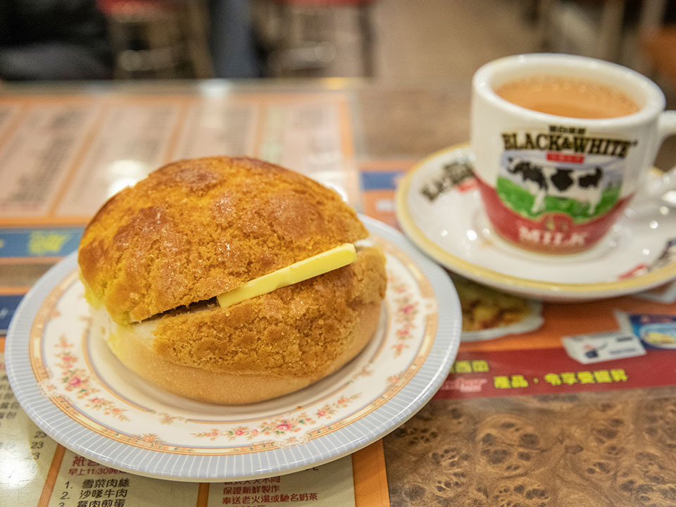 Pineapple bun with a slab of butter and Hong Kong-style milk tea.